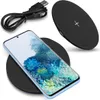 A smartphone is placed on a wireless charging pad, with a USB cable nearby. Produktbild-Vorschau