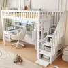 A white loft bed with a desk, chair, and storage stairs, set up in a room with a rug and a teddy bear. Anteprima dell’immagine prodotto