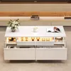 A modern white coffee table with drawers and LED lighting, set in a living room environment. Náhled obrázku produktu