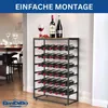 A wine rack filled with wine bottles, placed in a room with a dining table in the background. Anteprima dell’immagine prodotto