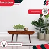 A wooden coffee table with plants and decorative items on it, set against a white background. Produktbild-Vorschau