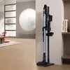 Der hellblaue Hitachi Akkusauger PV-XHE 4 PL MB in einem modern eingerichteten Wohnzimmer. Produktbild-Vorschau