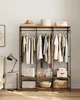 A bedroom scene with a wardrobe rack filled with clothes and storage boxes. Náhled obrázku produktu