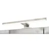 A close-up, studio shot of a modern LED light fixture mounted above a reflective surface, likely a mirror or cabinet. Produktbild-Vorschau