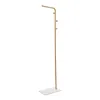 A gold coat rack with a white marble base, shown against a white background. Náhled obrázku produktu