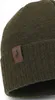 A close-up view of a dark green knitted winter hat with a brown leather logo patch. Voir les images du produit