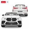 Two white BMW X6 M remote control cars are displayed against a white background. One car is shown from the front, and the other from the rear. Podgląd zdjęcia produktu