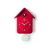 A red cuckoo clock with a pendulum against a white background. Produktbild-Vorschau