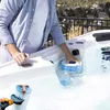 A person is cleaning a hot tub filter with a brush attachment connected to a garden hose. Produktbild-Vorschau