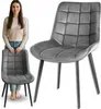 A woman stands next to a chair, with a close-up of the chair in the foreground. Náhľad obrázku produktu