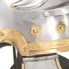 A close-up view of a Roman soldier's helmet replica, focusing on decorative metalwork. Voir les images du produit