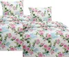 A close-up view of a floral patterned duvet cover and pillowcases. Produktbild-Vorschau