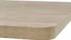 A close-up view of the edge of a wooden table with a rounded corner. Náhled obrázku produktu