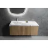 A modern bathroom vanity with a white sink and wooden cabinet, set against a textured gray wall and illuminated by a backlit mirror. Náhled obrázku produktu