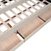 A close-up view of the wooden slats and drawers of a bed frame. Produktbild-Vorschau