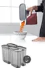 A person is pouring orange-colored spices from a storage container into a bowl. Produktbild-Vorschau