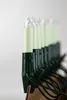 A row of candle-shaped lights with green bases and wires, set against a white background. Produktbild-Vorschau