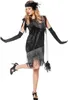 A woman is posing in a 1920s flapper costume. Produktbild-Vorschau