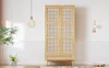 A wooden wardrobe with rattan-effect doors in a well-lit room with plants and decor. Produktbild-Vorschau