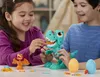 Two children are playing with a Play-Doh dinosaur toy. Náhled obrázku produktu