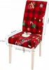 A Christmas-themed chair cover on a chair, with dimensions indicated. Náhled obrázku produktu