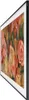 A side view of a Samsung QLED TV displaying a floral painting. Produktbild-Vorschau
