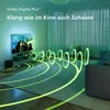 A living room with a TV, soundbar, and subwoofer, with glowing green sound waves emanating from the sound system. Voir les images du produit