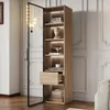 A tall, narrow wooden cabinet with a glass door, displaying various decorative items and storage. Voir les images du produit