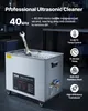 A professional ultrasonic cleaner is shown in a workshop setting, with a wrench inside. Podgląd zdjęcia produktu
