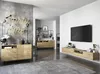 A modern living room with contemporary furniture, including a wall-mounted TV console and a side cabinet, all in a light wood finish. The room features a concrete effect wall with a neon 'Party Time' sign and framed artwork. Náhled obrázku produktu