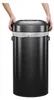 Hands placing the lid on a black trash can. Podgląd zdjęcia produktu