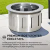 A stainless steel fire pit is shown outdoors on a patio with grass in the background. Náhled obrázku produktu