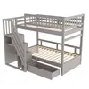 A gray bunk bed with stairs and a drawer, shown against a white background. Náhled obrázku produktu