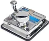 A close-up, angled view of a chrome cigarette rolling machine on a white background. Anteprima dell’immagine prodotto