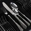 A close-up view of a set of cutlery, including forks, knives, and spoons, neatly arranged in a black case. Produktbild-Vorschau