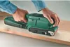 Hands holding a green belt sander on a wooden plank. Produktbild-Vorschau