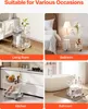 A collage of four images showing a clear acrylic rolling cart used in different home settings: living room, bedroom, kitchen, and bathroom. Produktbild-Vorschau