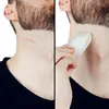 A split image showing a man's neck with a small cut on the left side and a hand holding a white block of alum stone to the cut on the right side. Podgląd zdjęcia produktu