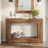 A wooden console table with decorative items and books, placed in an entryway or living room. Produktbild-Vorschau