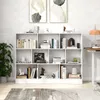A white bookshelf filled with books and decorative items, placed against a textured wall. Náhľad obrázku produktu