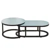 A modern coffee table with a round and an oval top, made of glass and metal. Náhľad obrázku produktu