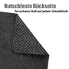 A close-up view of the underside of a dark gray desk mat, showing its anti-slip texture. Produktbild-Vorschau