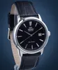 A close-up studio shot of a black Orient Bambino watch with a black leather strap. Voir les images du produit