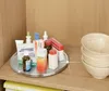 A rotating tray with various medicines and medical supplies on a wooden shelf. Anteprima dell’immagine prodotto