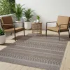 An outdoor patio scene with furniture and plants. Náhľad obrázku produktu