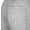 A close-up view of the back pocket of grey sweatpants. Produktbild-Vorschau