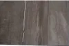 A close-up view of a wooden surface, likely a table top, showing the grain and texture. Produktbild-Vorschau