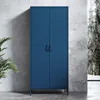 A blue metal cabinet is shown in front of a concrete wall with a window showing trees in the background. Náhľad obrázku produktu