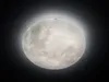 A close-up, well-lit image of a full moon against a dark background, with a subtle glow around it. Náhled obrázku produktu