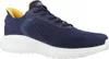 A single navy blue sneaker with yellow accents and a white sole is shown against a white background. Voir les images du produit
